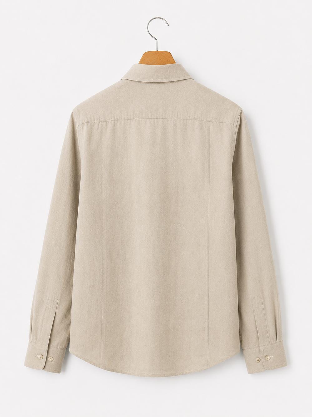 Beige shirt on a hanger against a white background