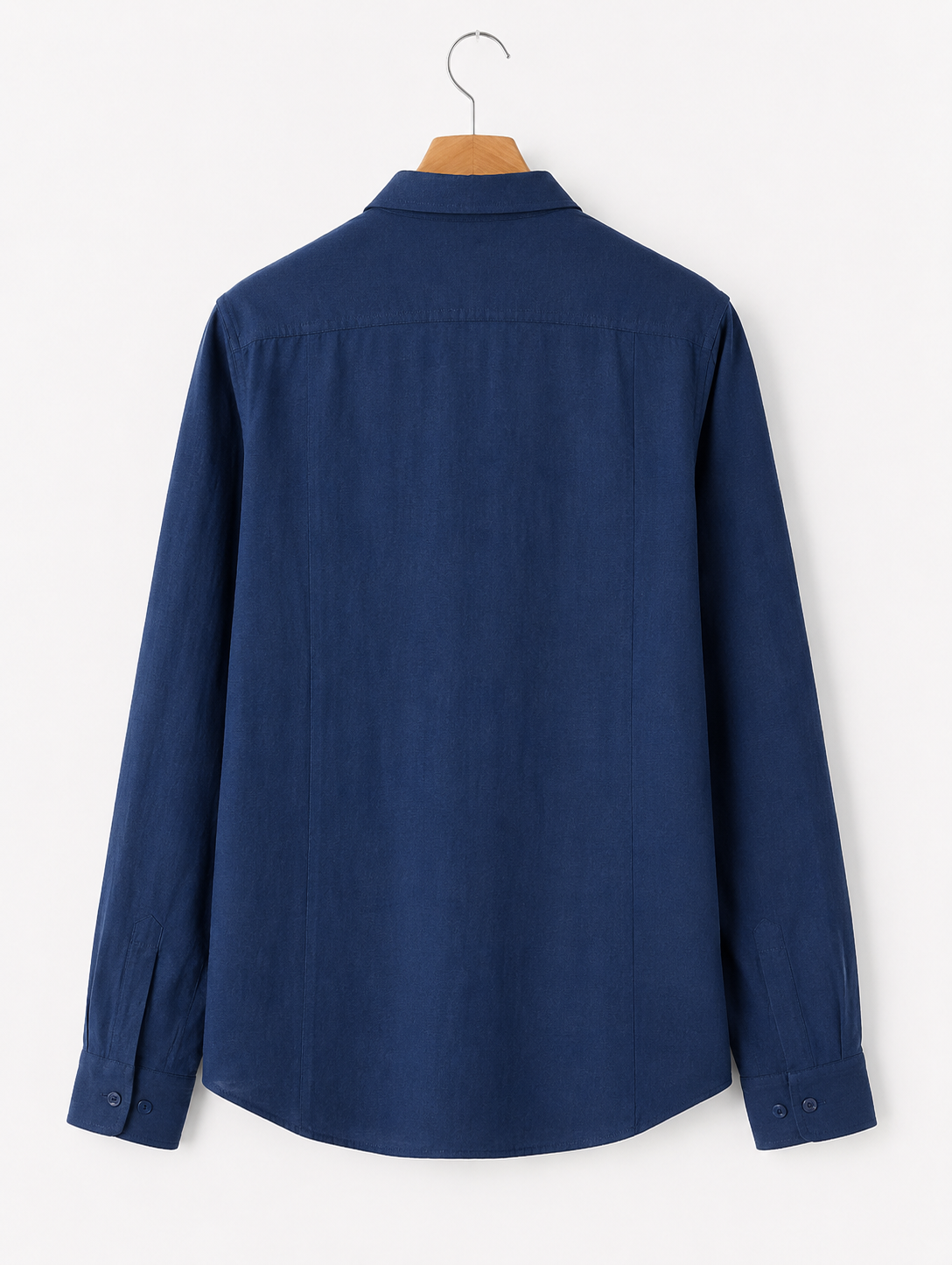 Blue shirt on a hanger against a white background
