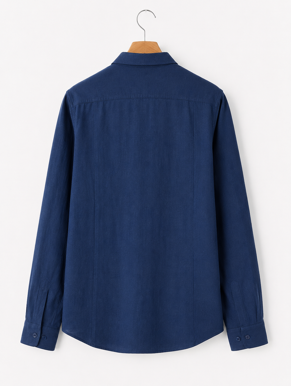 Blue shirt on a hanger against a white background