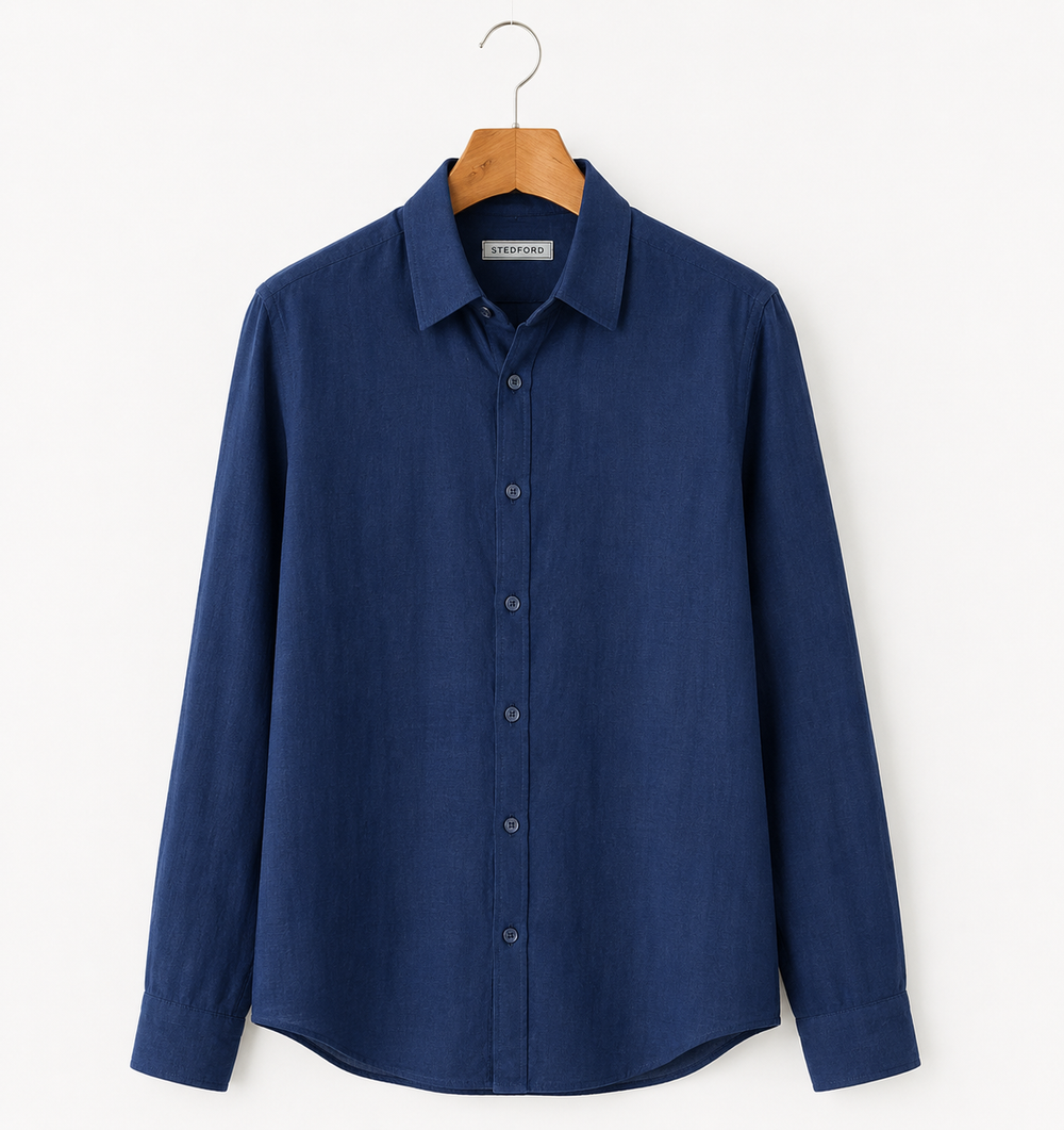 Blue shirt on a hanger against a white background