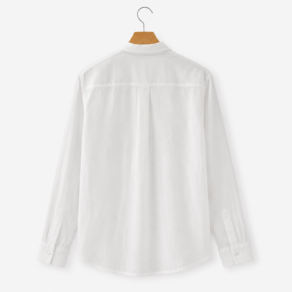 White shirt on a hanger against a white background