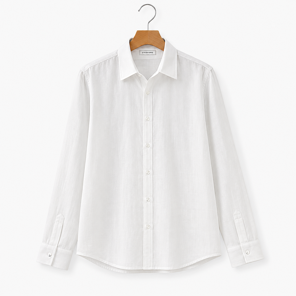 White dress shirt on a hanger against a white background