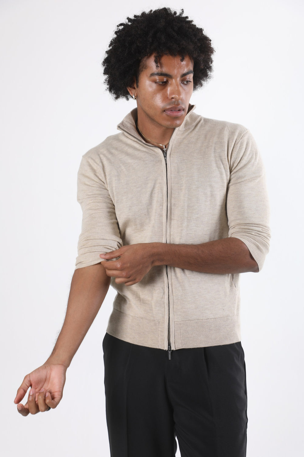 Stedford model wearing a beige zip-up hoodie against a white background