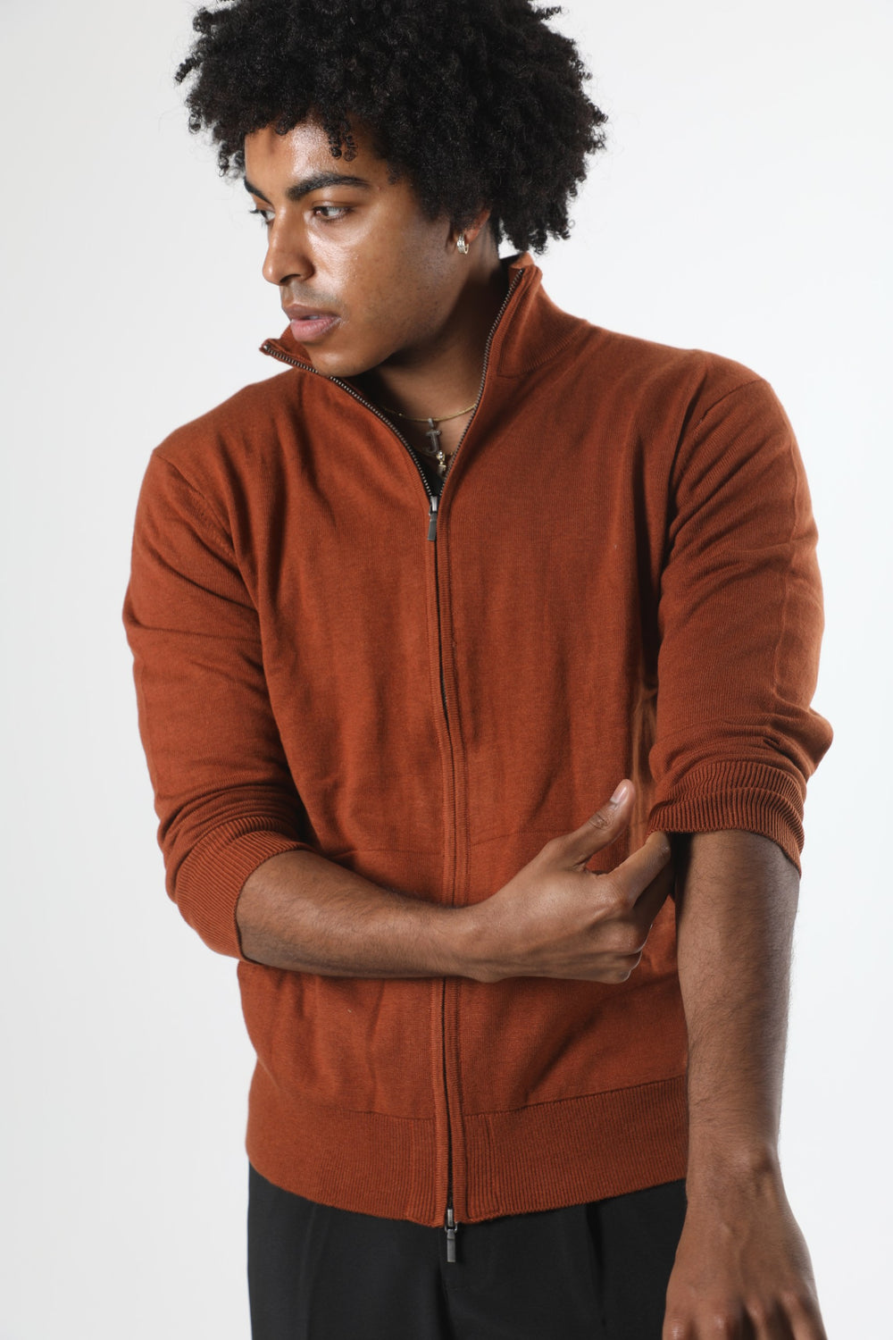 Stedford model wearing a brown zip-up sweatshirt against a white background